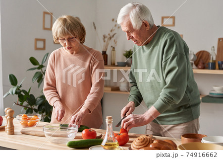 Family cooking together in the kitchen 74916662