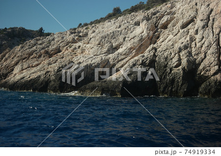 Sandstone rock formation at Mediterranean sea coast. 74919334