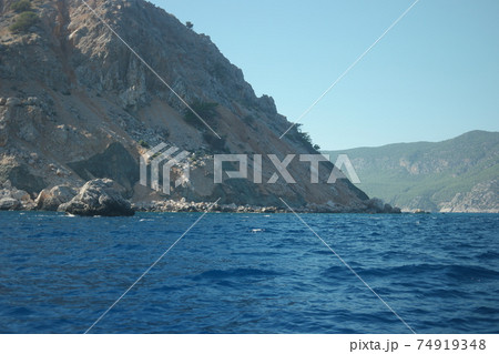 Summer seascape with mountains and blue sea water. 74919348