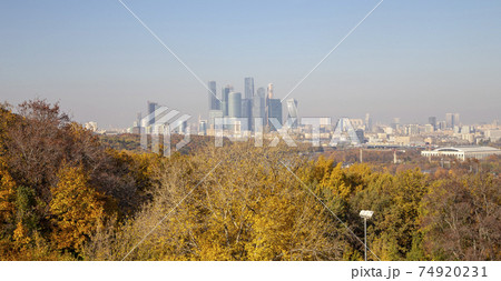 View of the city and the complex of skyscrapers Moscow city from Sparrow Hills or Vorobyovy Gory observation (viewing) platform-- is on a steep bank 85 m above the Moskva river, or 200 m above sea 74920231