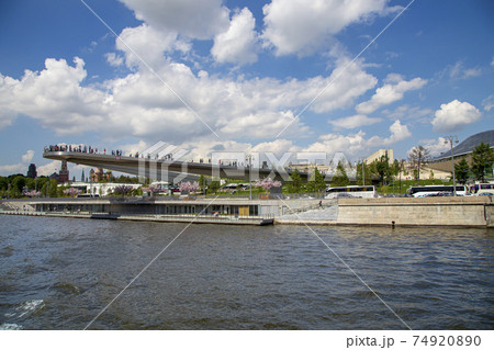 Floating bridge of Zaryadye park on Moskvoretskaya Embankment of Moskva River in Moscow, Russia. Shooting from a tourist pleasure boat 74920890