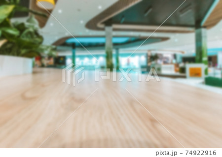 Shopping mall interior blurred background. People shopping in modern commercial mall center. Interior of retail centre store in soft focus. Image for background use. Shopping mall interior blurred background. People shopping in modern commercial mall center. Interior of retail centre store in soft focus. Image for background use. 74922916