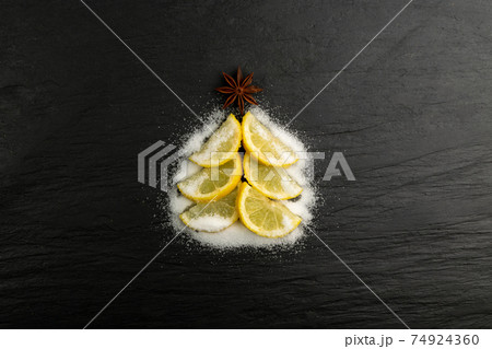 Christmas tree made of lemon slices isolated Christmas tree made of lemon slices isolated 74924360