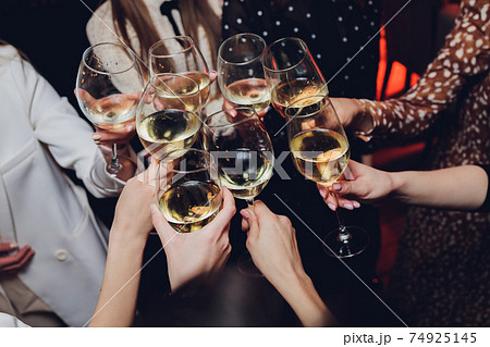 Clinking glasses with alcohol and toasting, party. Clinking glasses with alcohol and toasting, party. 74925145