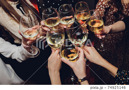 Clinking glasses with alcohol and toasting, party. Clinking glasses with alcohol and toasting, party. 74925146