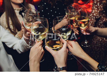 Clinking glasses with alcohol and toasting, party. Clinking glasses with alcohol and toasting, party. 74925147