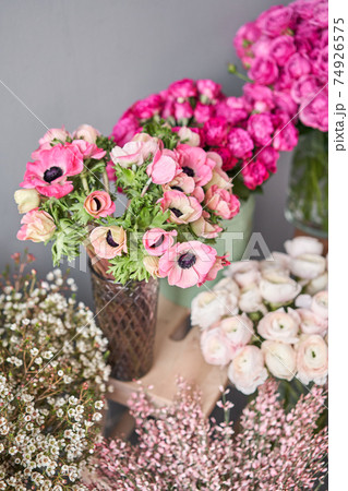 Set of white, pink and magenta flowers for Interior decorations. The work of the florist at a flower shop. Fresh cut flower. Set of white, pink and magenta flowers for Interior decorations. The work of the florist at a flower shop. Fresh cut flower. 74926575