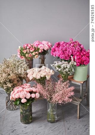 Set of white, pink and magenta flowers for Interior decorations. The work of the florist at a flower shop. Fresh cut flower. Set of white, pink and magenta flowers for Interior decorations. The work of the florist at a flower shop. Fresh cut flower. 74926585