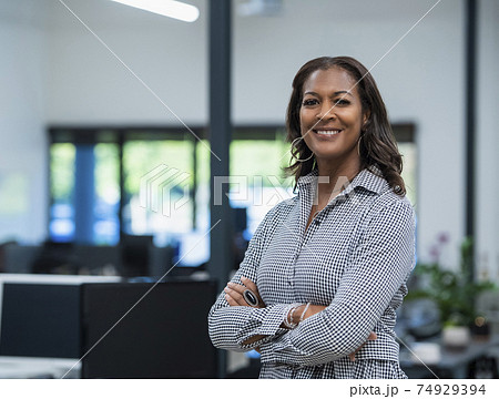 Portrait of business woman in office Portrait of business woman in office 74929394