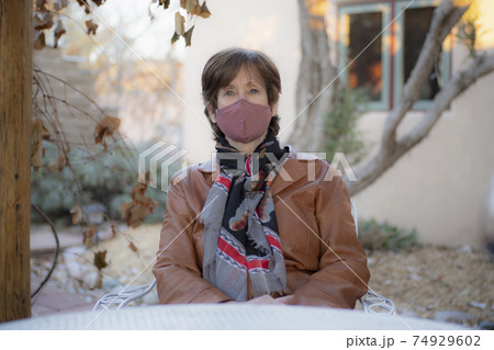 Portrait of woman wearing protective face mask 74929602