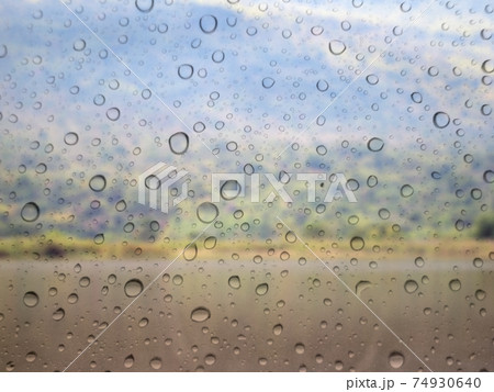 Close-up of water drops on glass surface as background Close-up of water drops on glass surface as background 74930640