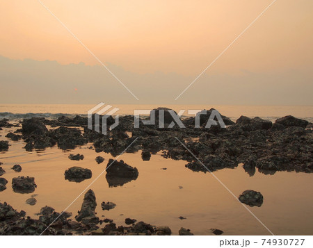 Slow shutter seascape view and beautiful sunrise 74930727