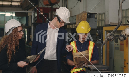 business engineering in hardhats discuss information on laptop computer business engineering in hardhats discuss information on laptop computer 74931777
