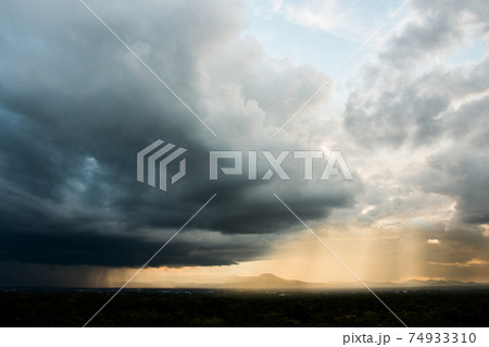 Storm clouds with the rain. Nature Environment Dark huge cloud sky black stormy cloud 74933310
