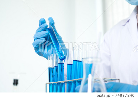 Medical scientists have experimented with liquid chemicals in vitro to analyze viral data in chemical laboratories. Scientific research concepts 74937840