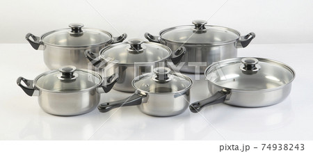 Set of stainless pots with lids isolated on white 74938243