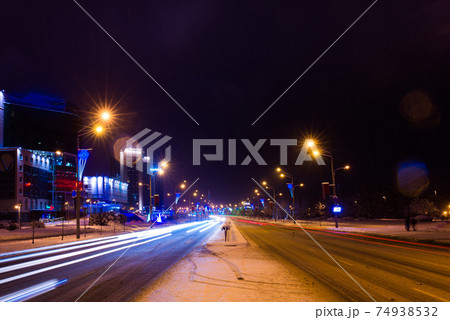 Road in the winter night, city, cars, lights, speed. Road in the winter night, city, cars, lights, speed. 74938532