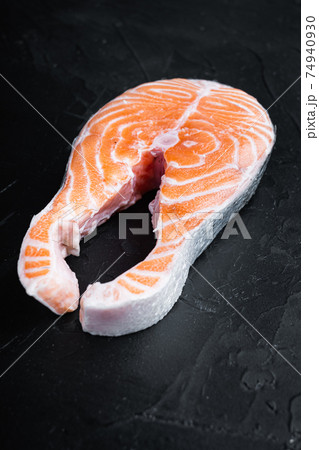 Fesh raw trout fillet, over black background 74940930