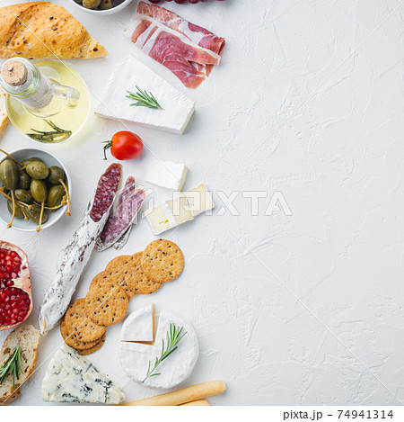 Ingredients for Italian food, meat cheede, herbs, on white background, top view with copy space for text Ingredients for Italian food, meat cheede, herbs, on white background, top view with copy space for text 74941314