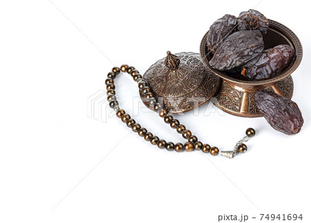 Dates on a bronze plate isolated Dates on a bronze plate isolated 74941694
