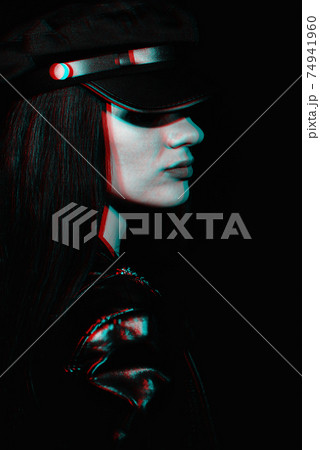 portrait of a young girl in a leather jacket and cap 74941960