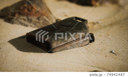old rusty fuel canister in the desert old rusty fuel canister in the desert 74942487