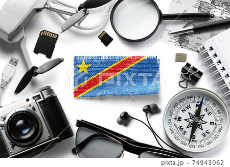 Flag of Democratic Republic of the Congo and travel accessories on a white background. 74943062