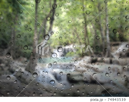 Close-up of water drops on glass surface as background 74943539