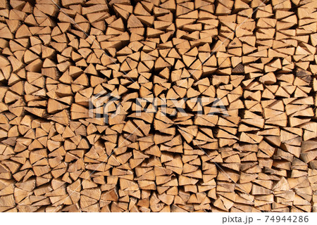 landscape format of wood stacked in a pile 74944286