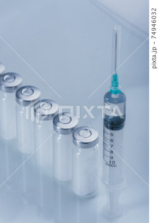 Medicine, Injection, vaccine and disposable syringe, drug concept. Sterile vial medical syringe needle. Glass medical ampoule vial for injection. Medicine, Injection, vaccine and disposable syringe, drug concept. Sterile vial medical syringe needle. Glass medical ampoule vial for injection. 74946032