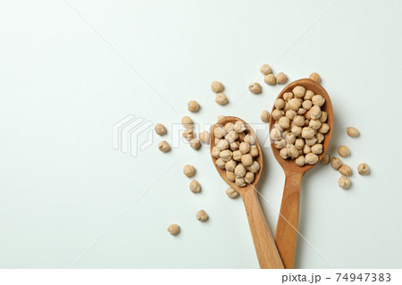 Spoons with fresh chickpea on white background 74947383