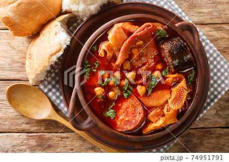 Slow Cooker Callos spanish traditional food closeup in the bowl. horizontal top view Slow Cooker Callos spanish traditional food closeup in the bowl. horizontal top view 74951791