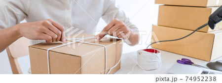 Shipment Online Sales, Small business or SME entrepreneur owner delivery service and working packing box, business owner working checking order to confirm before sending customer in post office 74952238