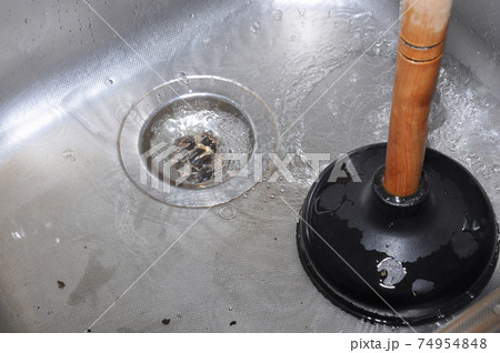 Plunger and kitchen sink. 74954848
