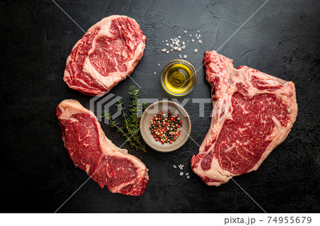 Variety of Raw Meat Steaks 74955679