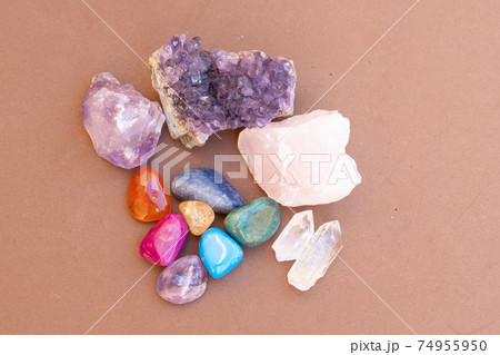 Healing crystals on brown background 74955950