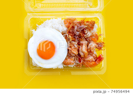 Spicy stir fried prawns with fried egg on rice Spicy stir fried prawns with fried egg on rice 74956494