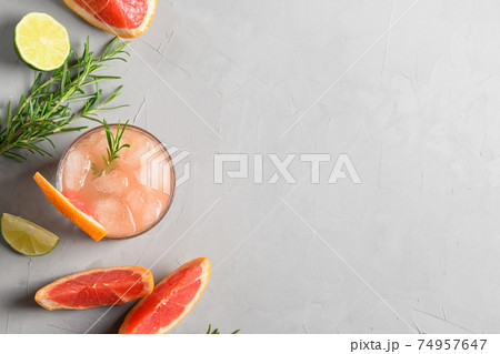 Grapefruit sparkling cocktails or lemonade garnish rosemary. View from above. Close up. 74957647