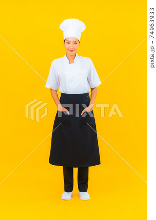 Portrait beautiful young asian woman in chef or cook uniform with hat Portrait beautiful young asian woman in chef or cook uniform with hat 74963933