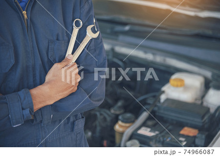 Mechanic car service auto garage in automotive mobile center. Technician workshop repair engine 74966087