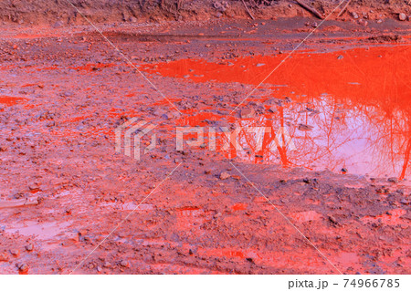 Close-up of red water polluted with iron ore waste Close-up of red water polluted with iron ore waste 74966785
