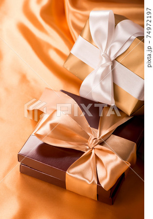sweet surprise, nice gift - brown box with candies and golden tape 74972197