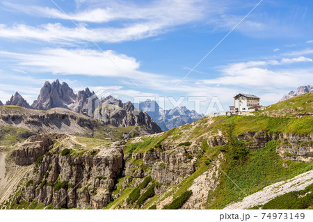 Italian Dolomites peaks and mountain hut. South Tyrol, Italy 74973149