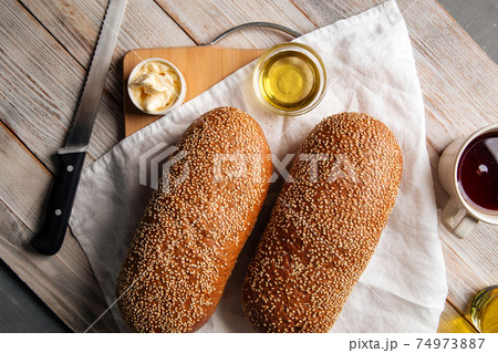 Top view on loafs of wheat and rye flour bread Top view on loafs of wheat and rye flour bread 74973887