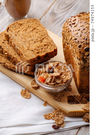 Cereal bread loafs on the wooden background Cereal bread loafs on the wooden background 74974155