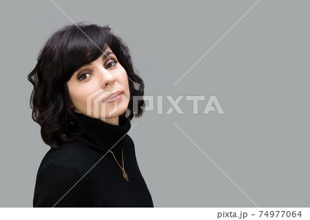 Adult beautiful brunette woman on gray background. Adult beautiful brunette woman on gray background. 74977064