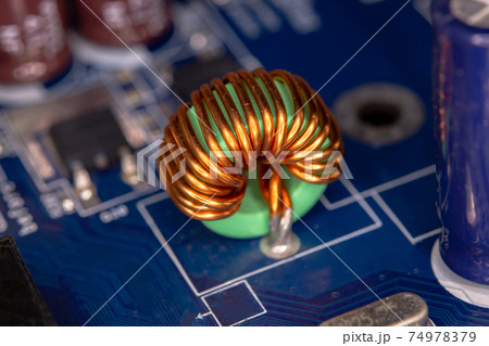 Inductor copper coils on the circuit board Inductor copper coils on the circuit board 74978379