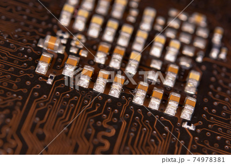 close up ceramic capacitors on electronic circuit board close up ceramic capacitors on electronic circuit board 74978381