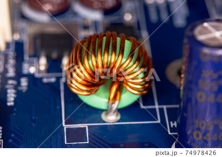 Inductor copper coils on the circuit board 74978426