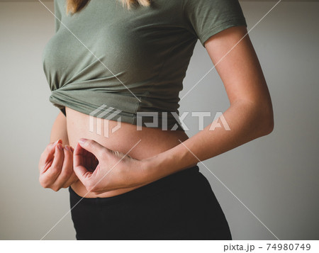 Slim Woman's Waist. People, sport, fitness and health concept. Close-up Slim Woman's Waist. People, sport, fitness and health concept. Close-up 74980749